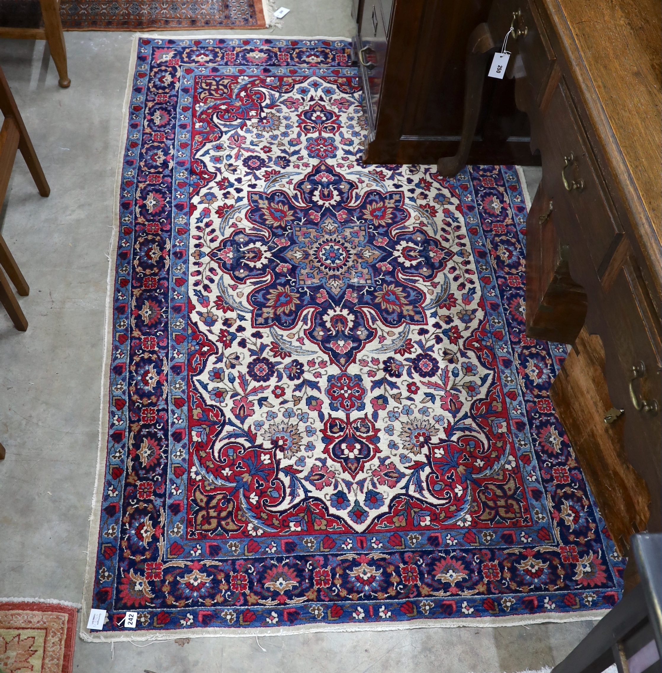 A North West Persian ivory ground rug, 205 x 118cm